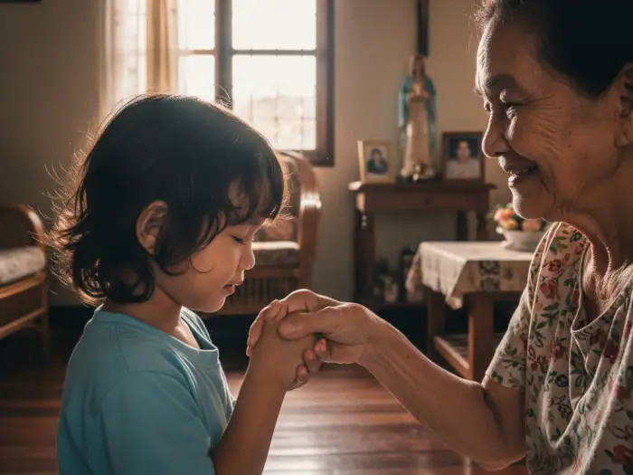 pagmamano filipino customs Filipino child doing mano po gesture to elder as tradition of respect and Filipino Customs.