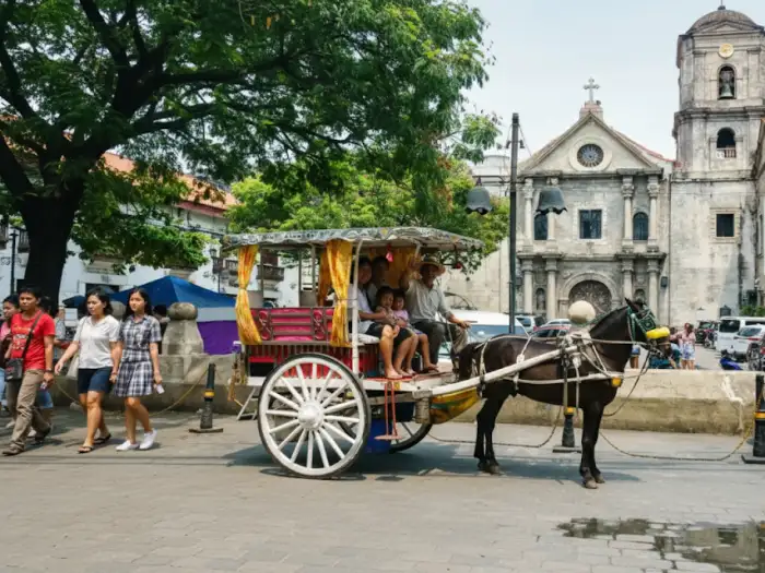 intramuros kalesa ride local Intramuros kalesa ride experience photo showing tourists and locals exploring the Walled City.