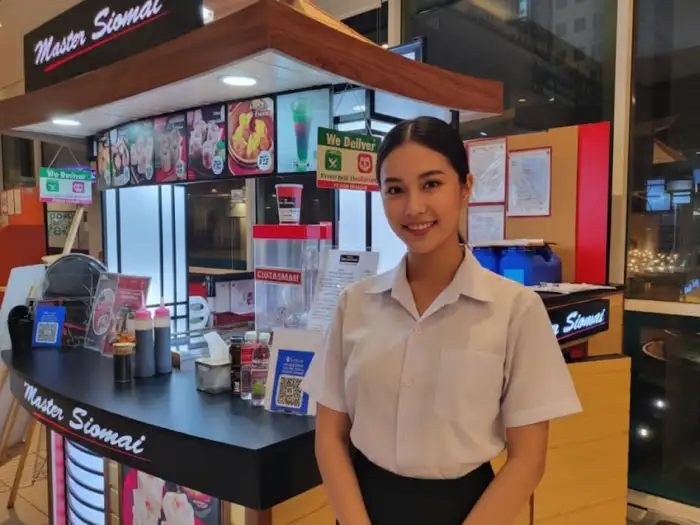 master siomai franchise booth Master Siomai food cart franchise booth with bright orange branding