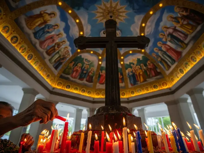 magellans cross cebu pavilion interior An interior view of the Magellan's Cross Pavilion in Cebu, showing the painted ceiling and a devotee lighting a candle.