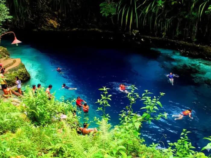 best time to visit enchanted river hinatuan Visitors swimming in the clear blue waters of the Enchanted River in Hinatuan.