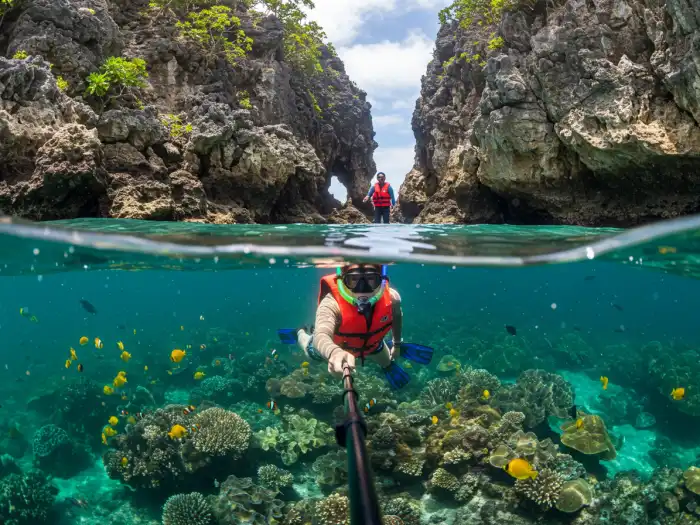 el nido secret beach tour c Snorkelers explore coral reefs and limestone-enclosed lagoons in El Nido’s Secret Beach.