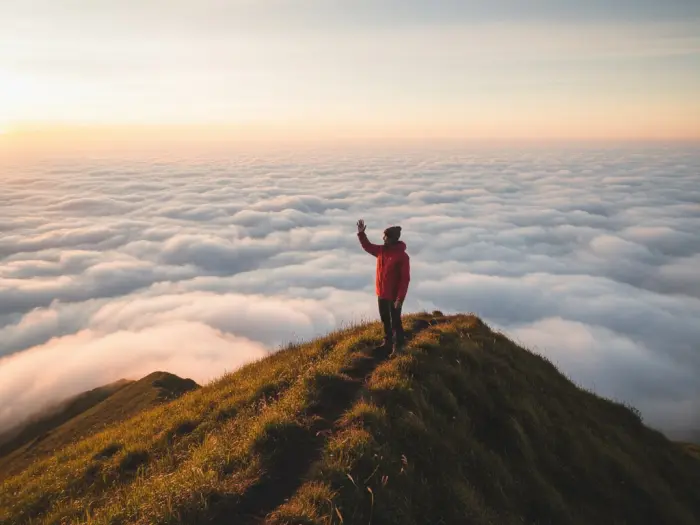 mount pulag sea of clouds best time visit Filipino hiker overlooking the golden sunrise and sea of clouds at Mount Pulag.