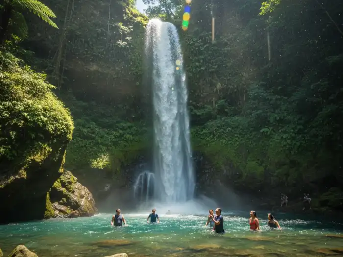 tumalog falls near oslob cebu side trip Tourists enjoying the misty waters of Tumalog Falls near Oslob, Cebu.
