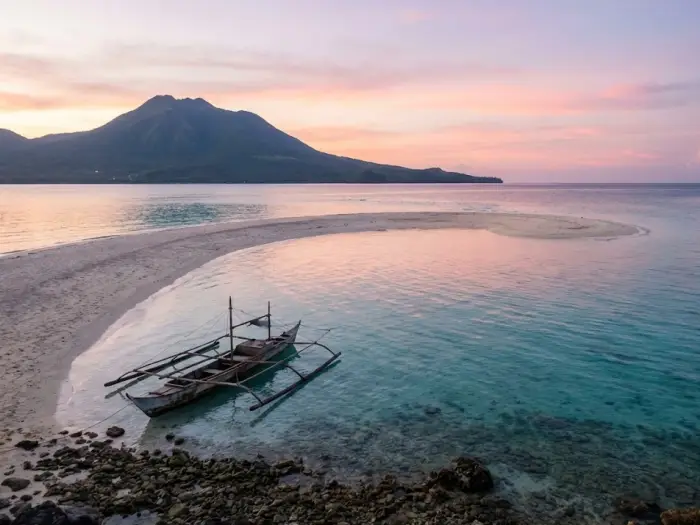 camiguin travel guide white island landscape White Island sandbar with clear blue water and Mt. Hibok Hibok rising behind it, created for a Camiguin Travel Guide featuring the island’s top attractions.